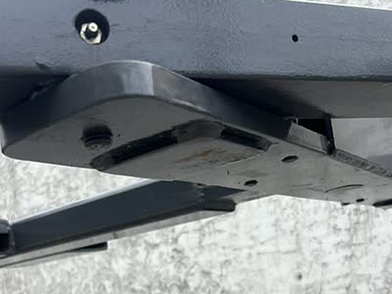 Underside of the Autowlift frame showing a worn steel skid plate