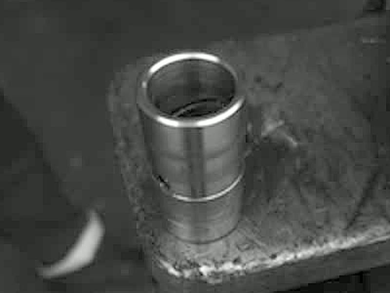 Machined bushing used in the Autowlift pivot assembly