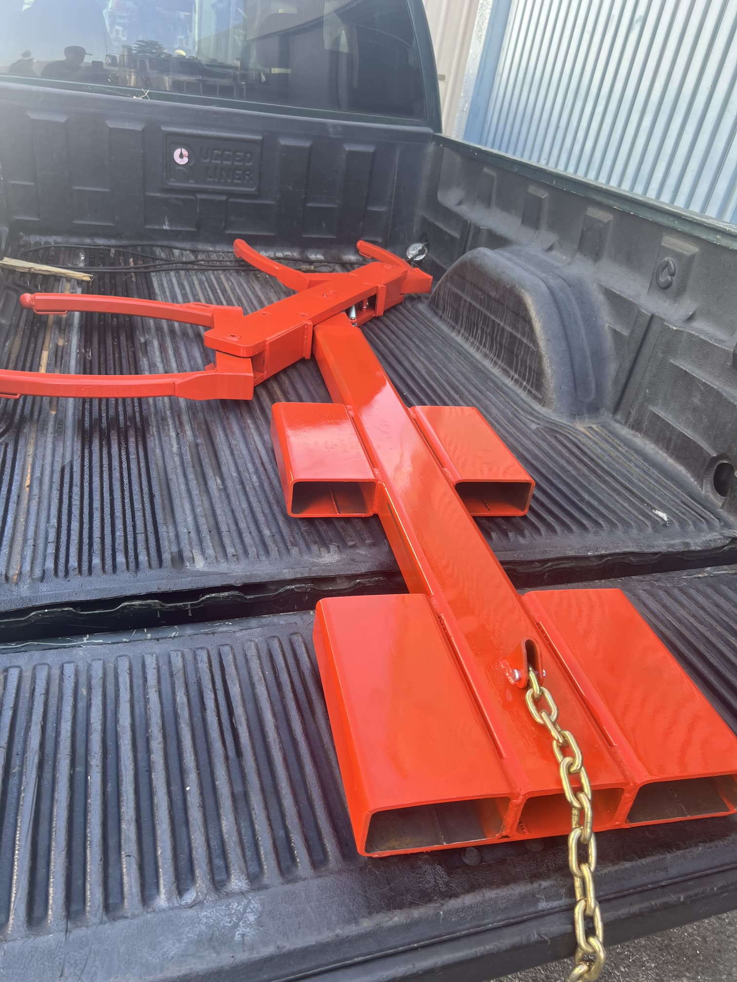 Autowlift attachment loaded in a pickup truck bed