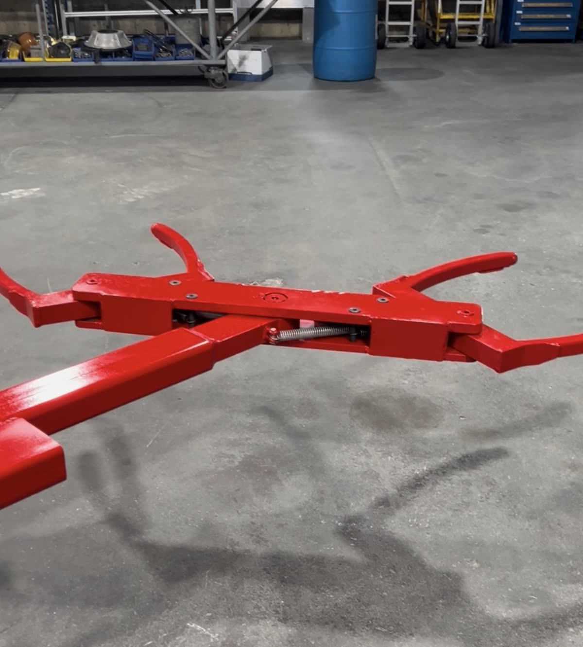 Autowlift attachment in red finish on a warehouse floor